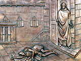 Das Bild zeigt ein Relief an einer Kirchentür in Palermo (Italien).