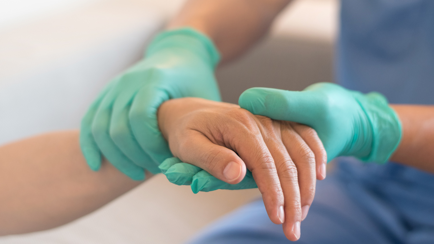Surgeon, physician performs surgical operations, anesthetist or anesthesiologist holding patient's hand for checking state of and or support in ER room, Medical healthcare concept 