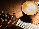 amenic181130800002.jpg - a cup of cafe latte and guitar on wooden table