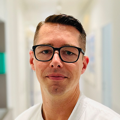 Vorsitzender der Ethikkommission, Facharzt für med. & chem. Labordiagnostik, stv. Leiter des Institutes für Labordiagnostik