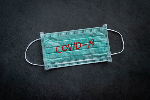 medical mask, protective mask with COVID-19 text. Chinese coronavirus outbreak situation. Novel coronavirus COVID-19, WUHAN virus concept. 