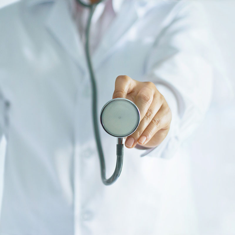 Medicine doctor holding stethoscope in hand on hospital background, medical and patient concept, blank text