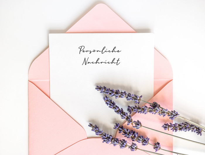 Top view pink envelope with copy space and lavender.